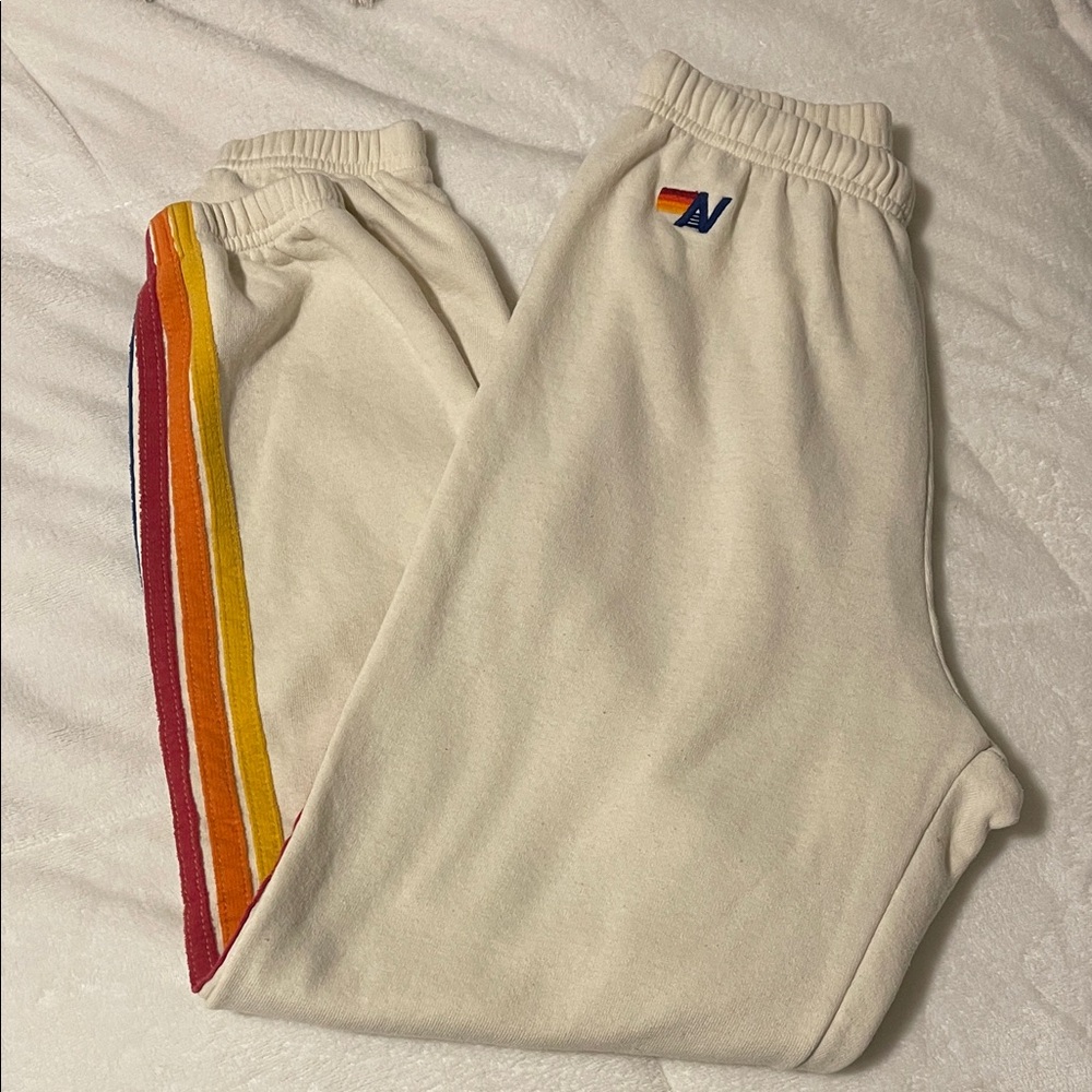 Aviator Nation Cream Track Joggers with Red, Orange & Yellow Stripes